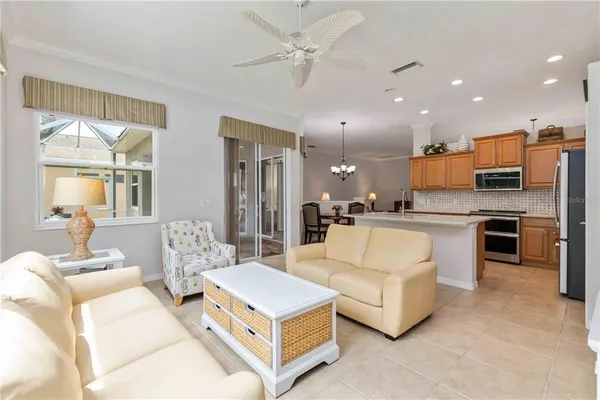 a bathroom with a tub a double vanity sink and mirror