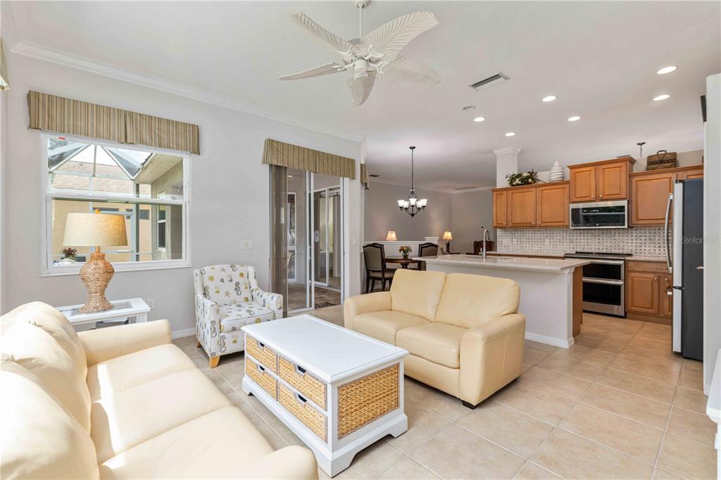 8150 Indigo Ridge Terrace University Park, FL 34201 - Photo 23 of 56 a living room with furniture and kitchen view