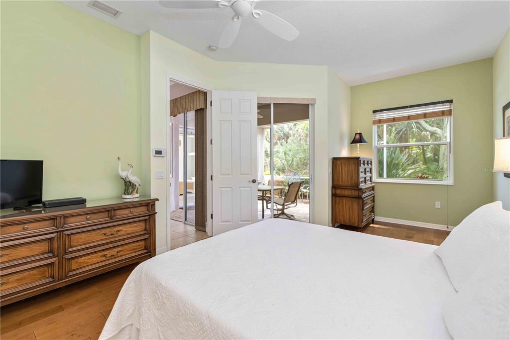 8150 Indigo Ridge Terrace University Park, FL 34201 - Photo 27 of 56 a bedroom with a bed and a flat tv screen on dresser