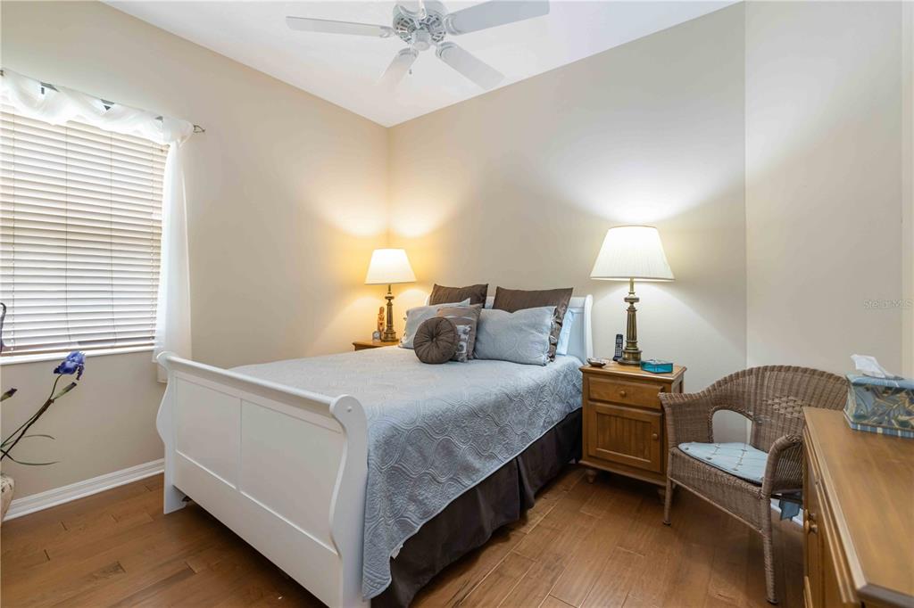 8150 Indigo Ridge Terrace University Park, FL 34201 - Photo 30 of 56 a bedroom with a bed and lamp