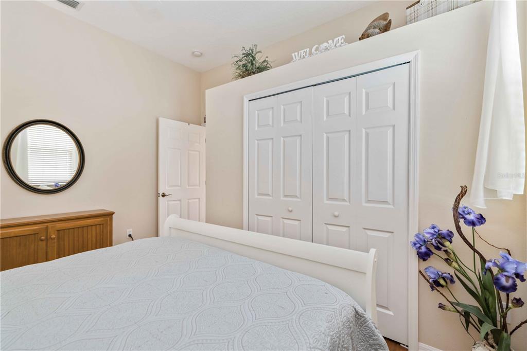 8150 Indigo Ridge Terrace University Park, FL 34201 - Photo 31 of 56 a bedroom with a bed and a chandelier