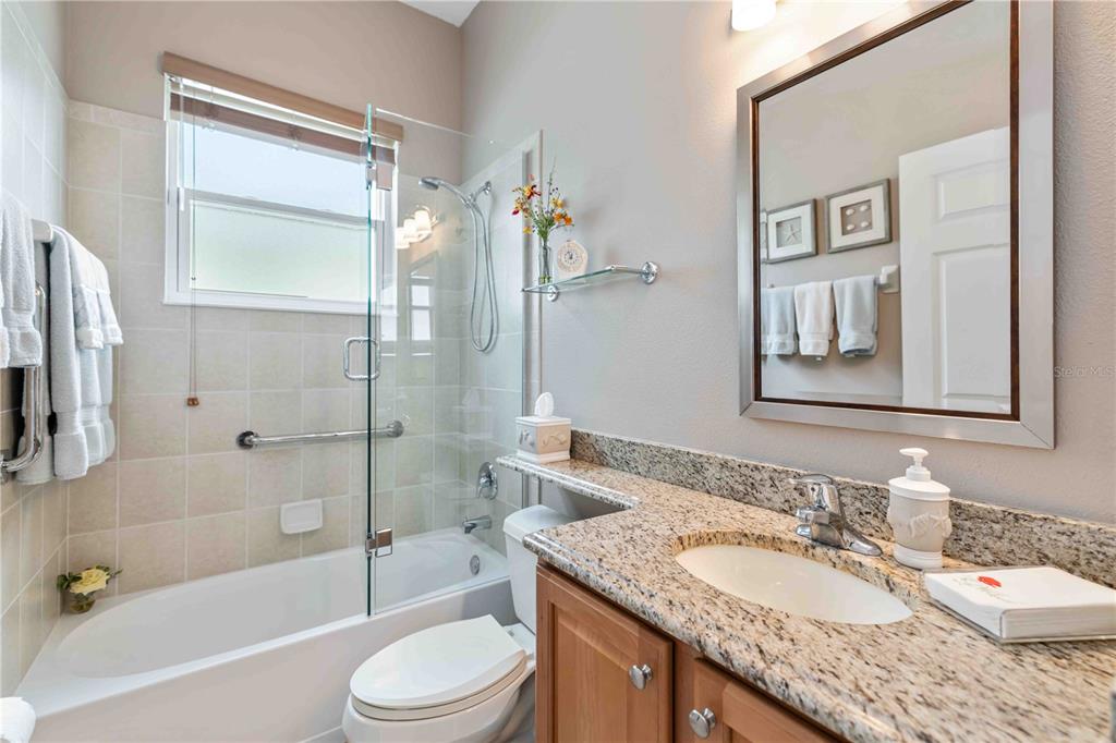 8150 Indigo Ridge Terrace University Park, FL 34201 - Photo 32 of 56 a bathroom with a granite countertop sink toilet and shower