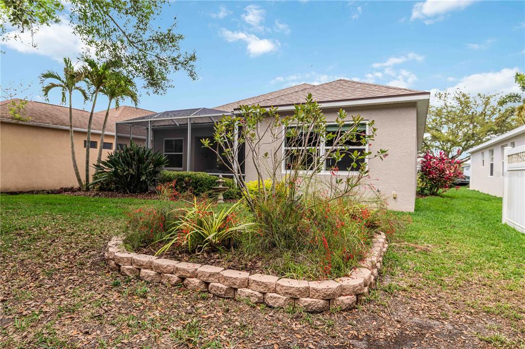 8150 Indigo Ridge Terrace University Park, FL 34201 - Photo 37 of 56 a front view of a house with garden