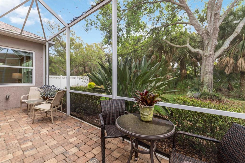 8150 Indigo Ridge Terrace University Park, FL 34201 - Photo 4 of 56 a view of a chair and tables in the balcony