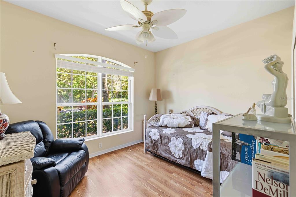 8150 Indigo Ridge Terrace University Park, FL 34201 - Photo 9 of 56 a bedroom with furniture and a large window