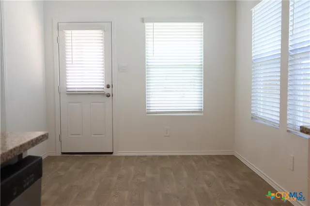 an empty room with windows