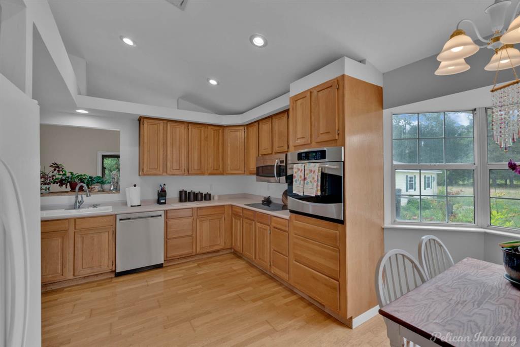 5905 Highway 175 Frierson, LA 71027 - Photo 16 of 29 a kitchen with cabinets a sink and appliances