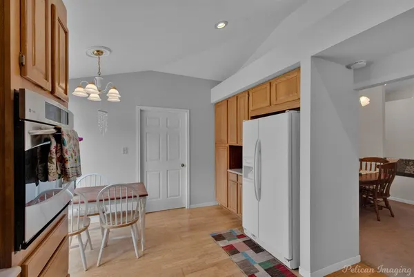 a view of a livingroom with furniture and chandelier