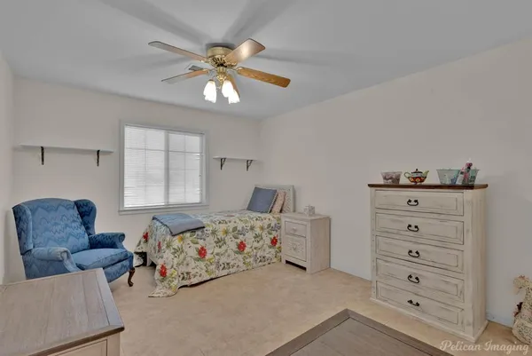 a bedroom with a bed and a couch