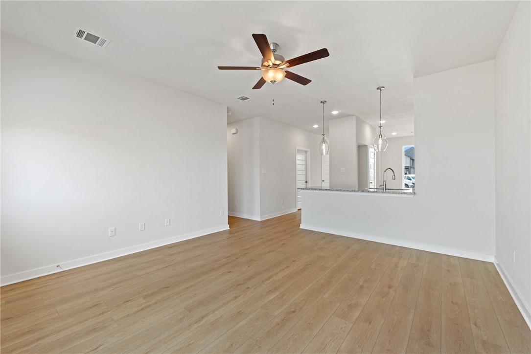 2412 Rooke Road Bryan, TX 77807 - Photo 16 of 35 a view of an empty room with a ceiling fan