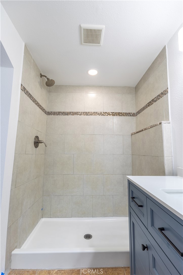 10495 Cook Riverside, CA 92505 - Photo 11 of 19 a bathroom with a bathtub and a shower