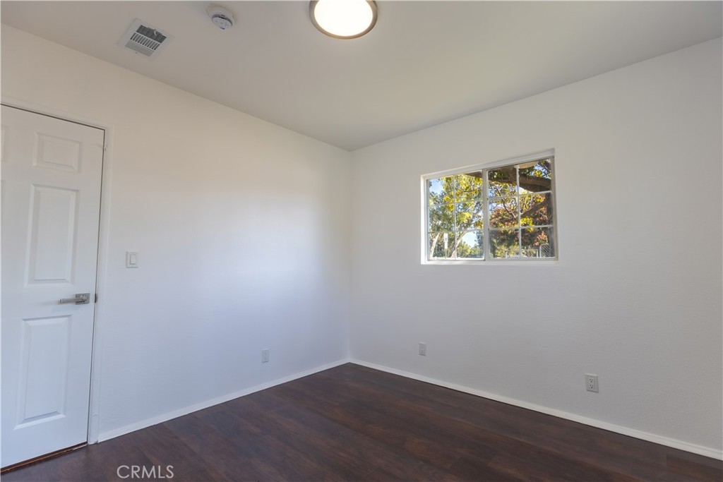10495 Cook Riverside, CA 92505 - Photo 17 of 19 an empty room with wooden floor and window