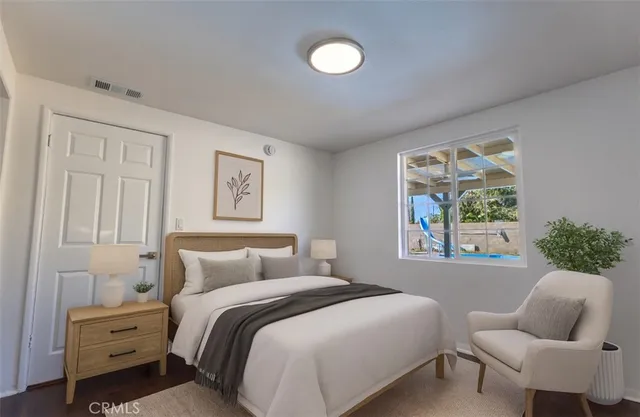 a bedroom with a bed and a window