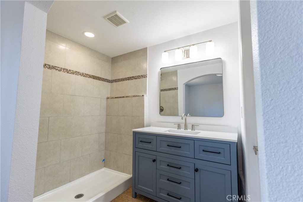 10495 Cook Riverside, CA 92505 - Photo 10 of 19 a bathroom with a sink shower and a mirror