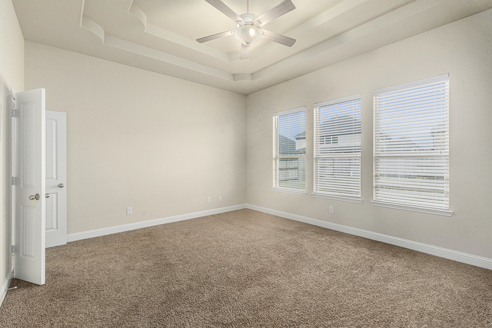 18614 Rimini Ridge Court Cypress, TX 77429 - Photo 13 of 35 an empty room with windows and fan