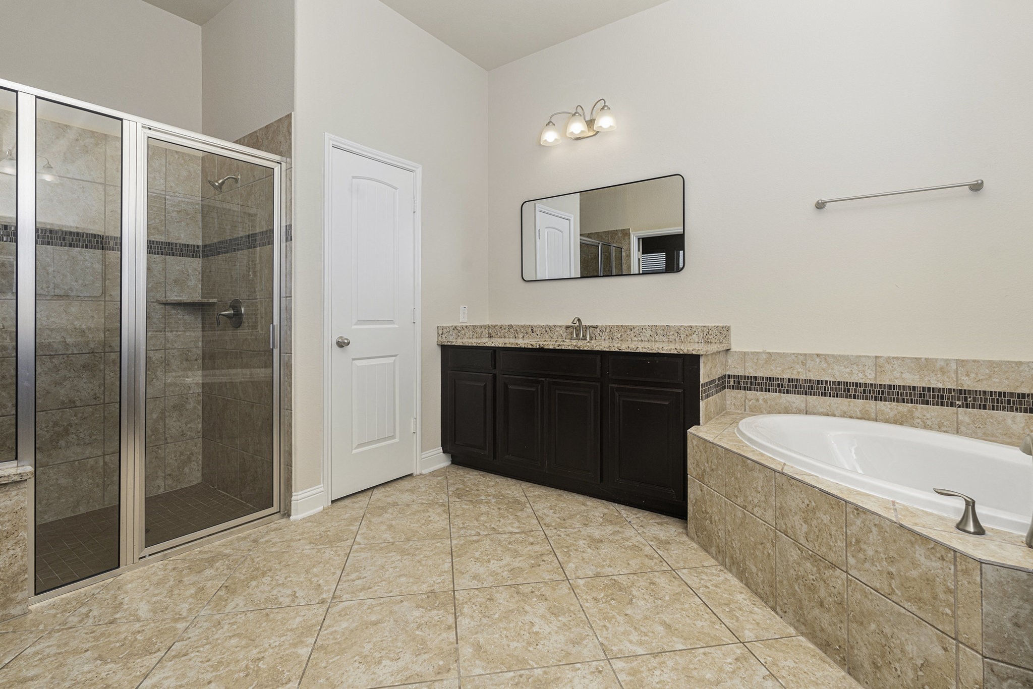 18614 Rimini Ridge Court Cypress, TX 77429 - Photo 16 of 35 a spacious bathroom with a tub sink and mirror
