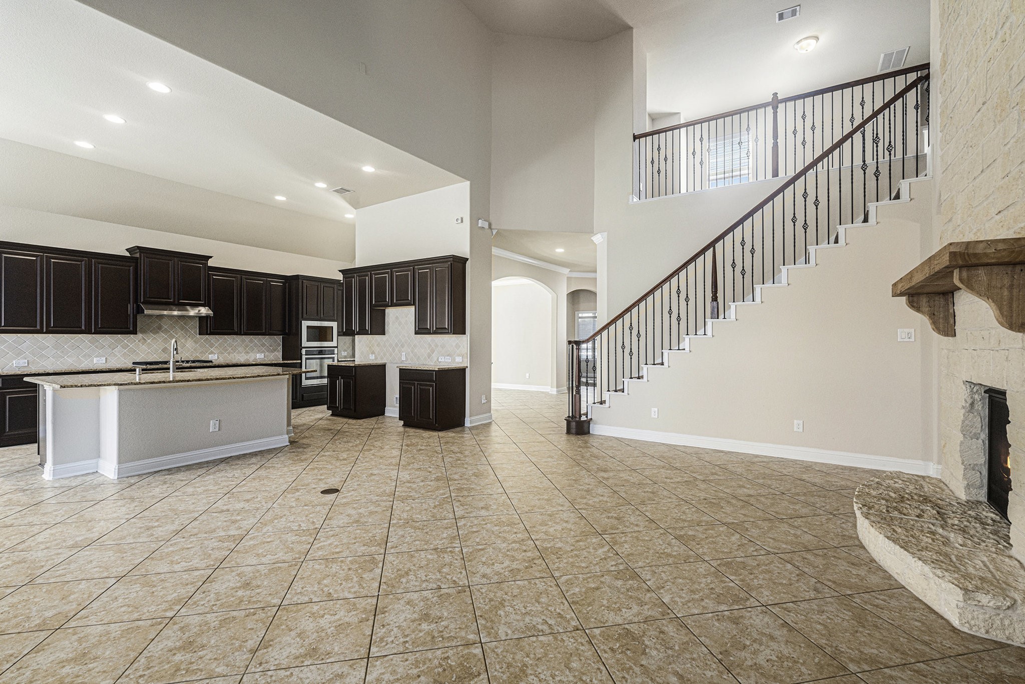 18614 Rimini Ridge Court Cypress, TX 77429 - Photo 5 of 35 a view of kitchen with stainless steel appliances kitchen island granite countertop a sink and cabinets