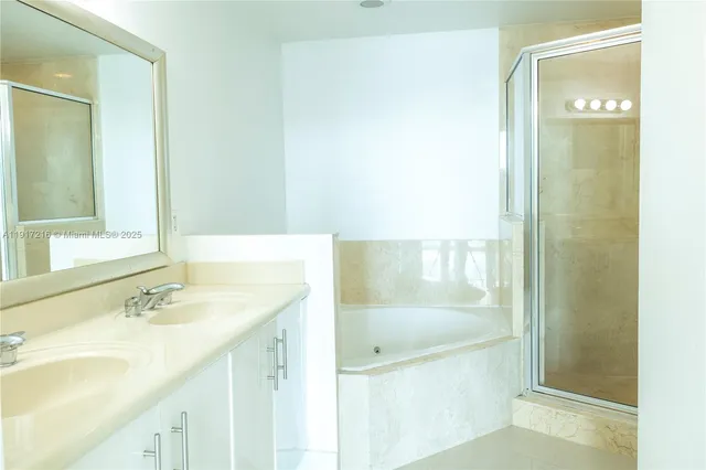 a bathroom with a bathtub and a sink