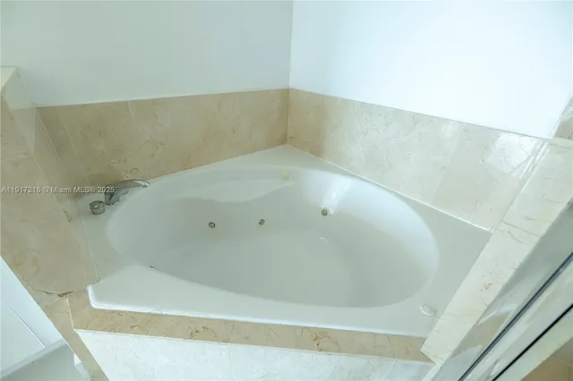 a view of a bathtub in bathroom