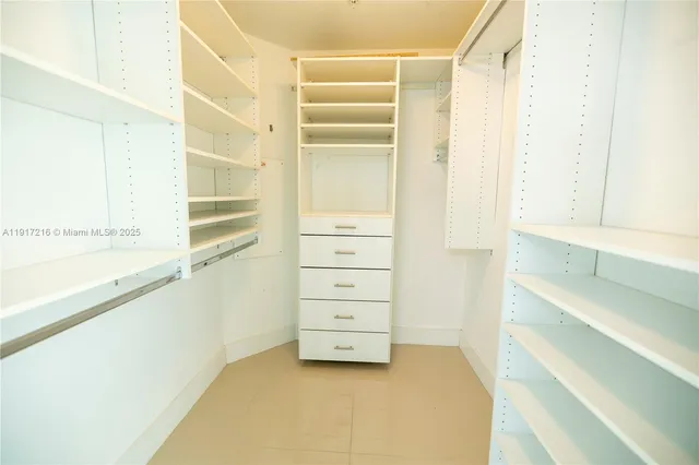 a bathroom with a sink mirror toilet and bathtub