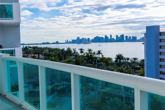 a view of a swimming pool with a garden and trees