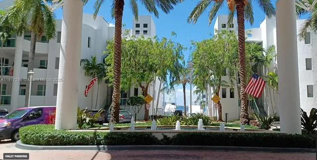 an aerial view of a house with a yard and potted plants