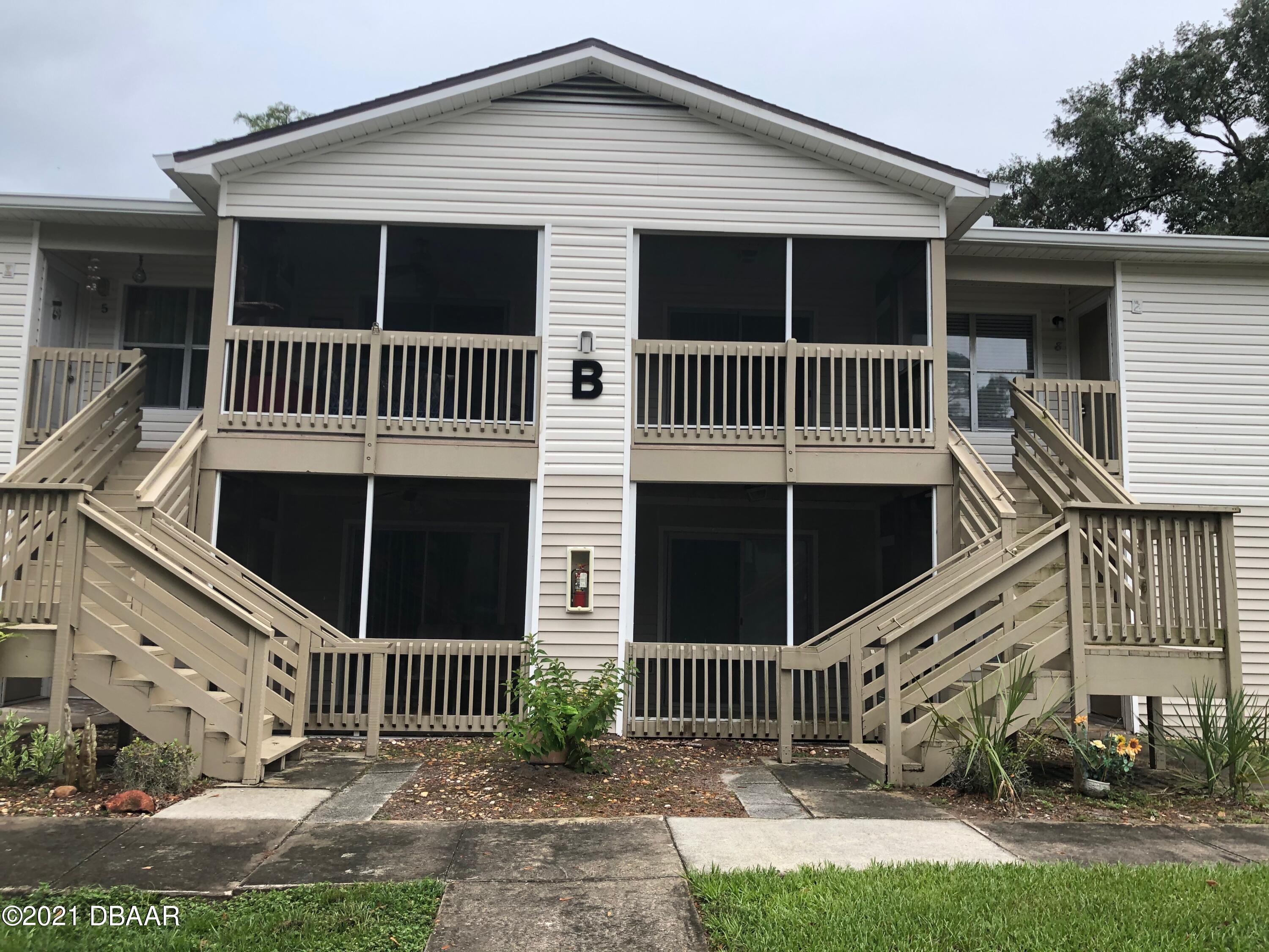 1600 Big Tree Road, Unit B8 South Daytona, FL 32119 - Photo 1 of 27 a view of a house with a yard from a patio