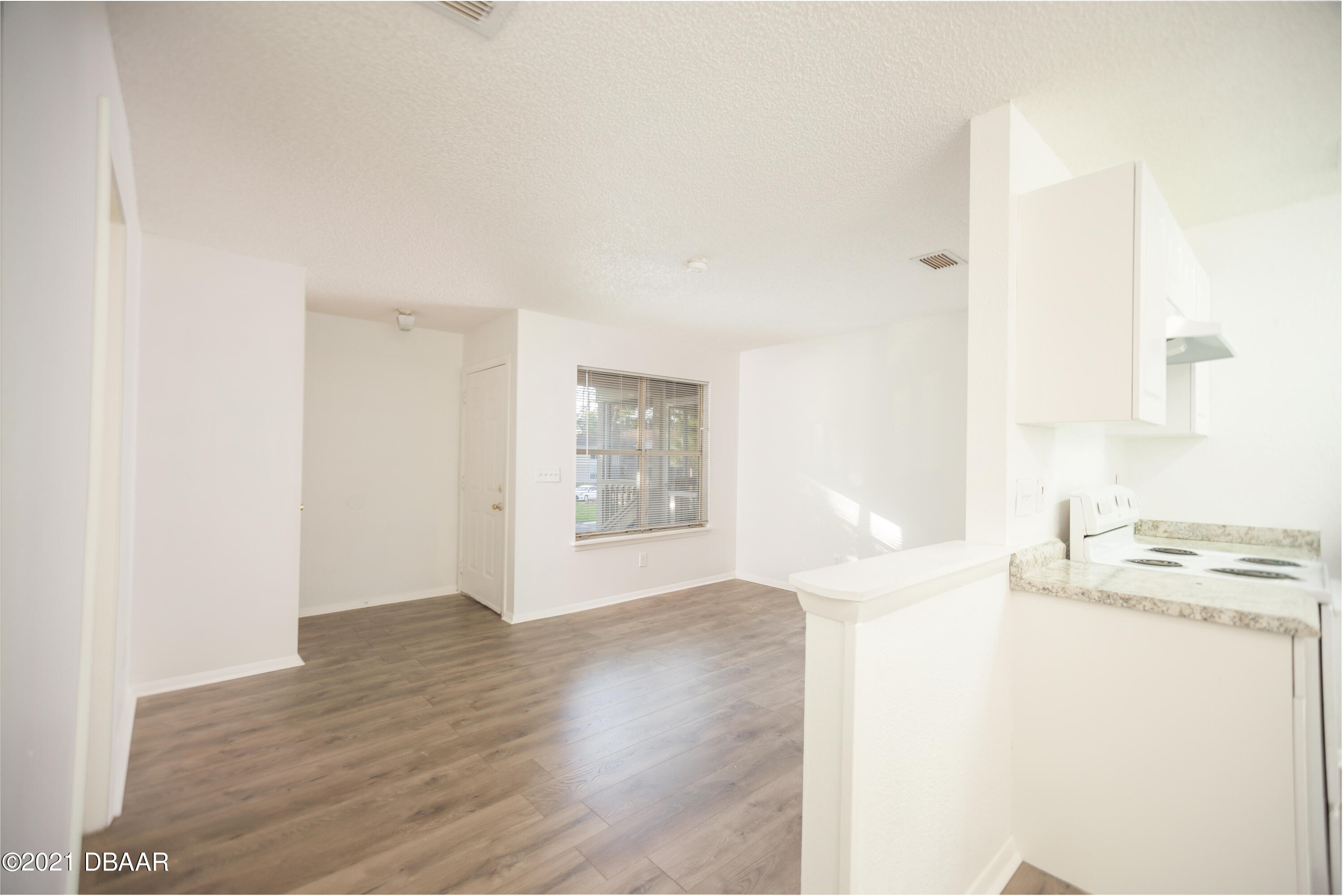 1600 Big Tree Road, Unit B8 South Daytona, FL 32119 - Photo 13 of 27 a view of a kitchen cabinets and wooden floor