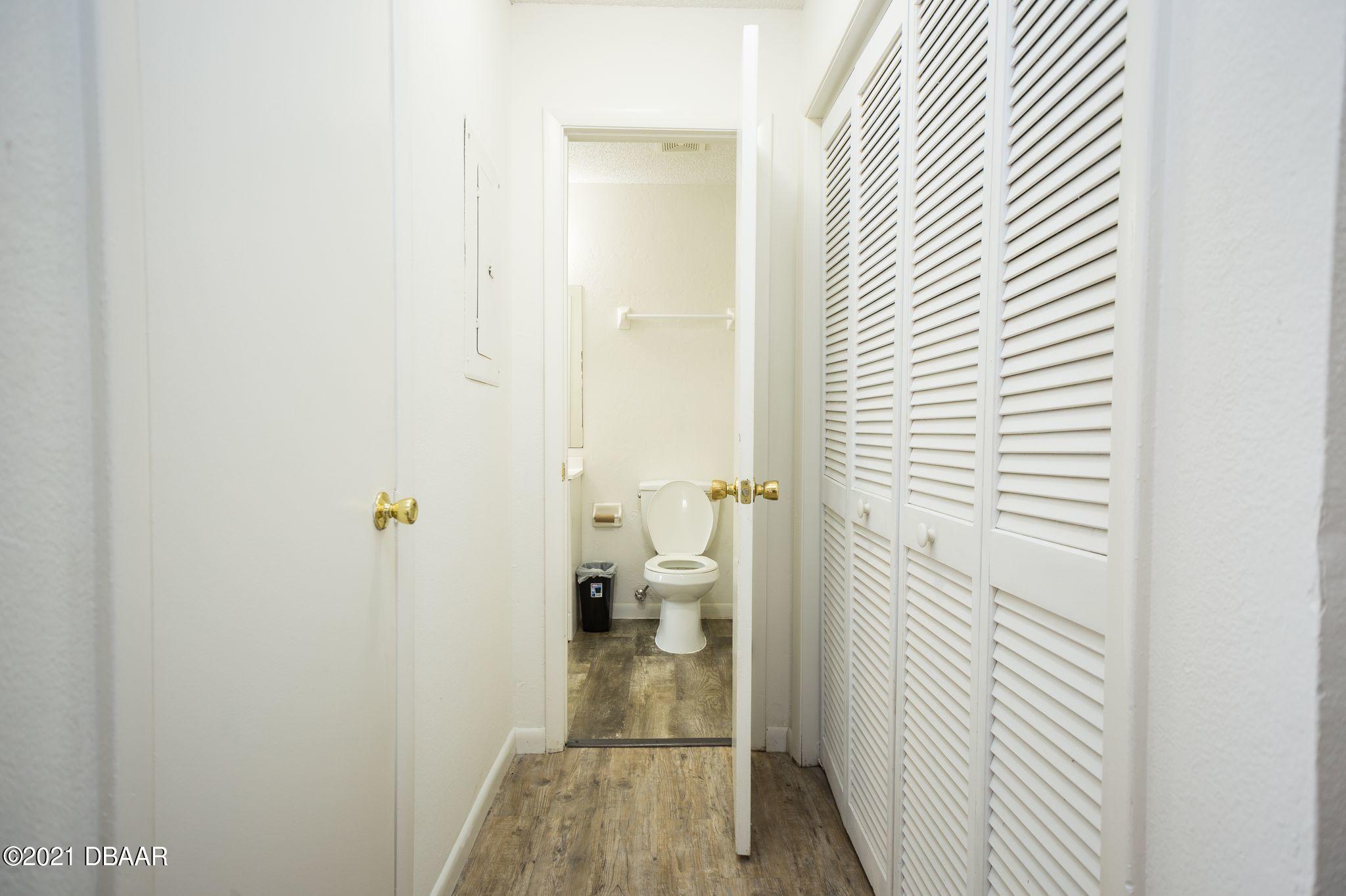 1600 Big Tree Road, Unit B8 South Daytona, FL 32119 - Photo 18 of 27 a bathroom with a toilet
