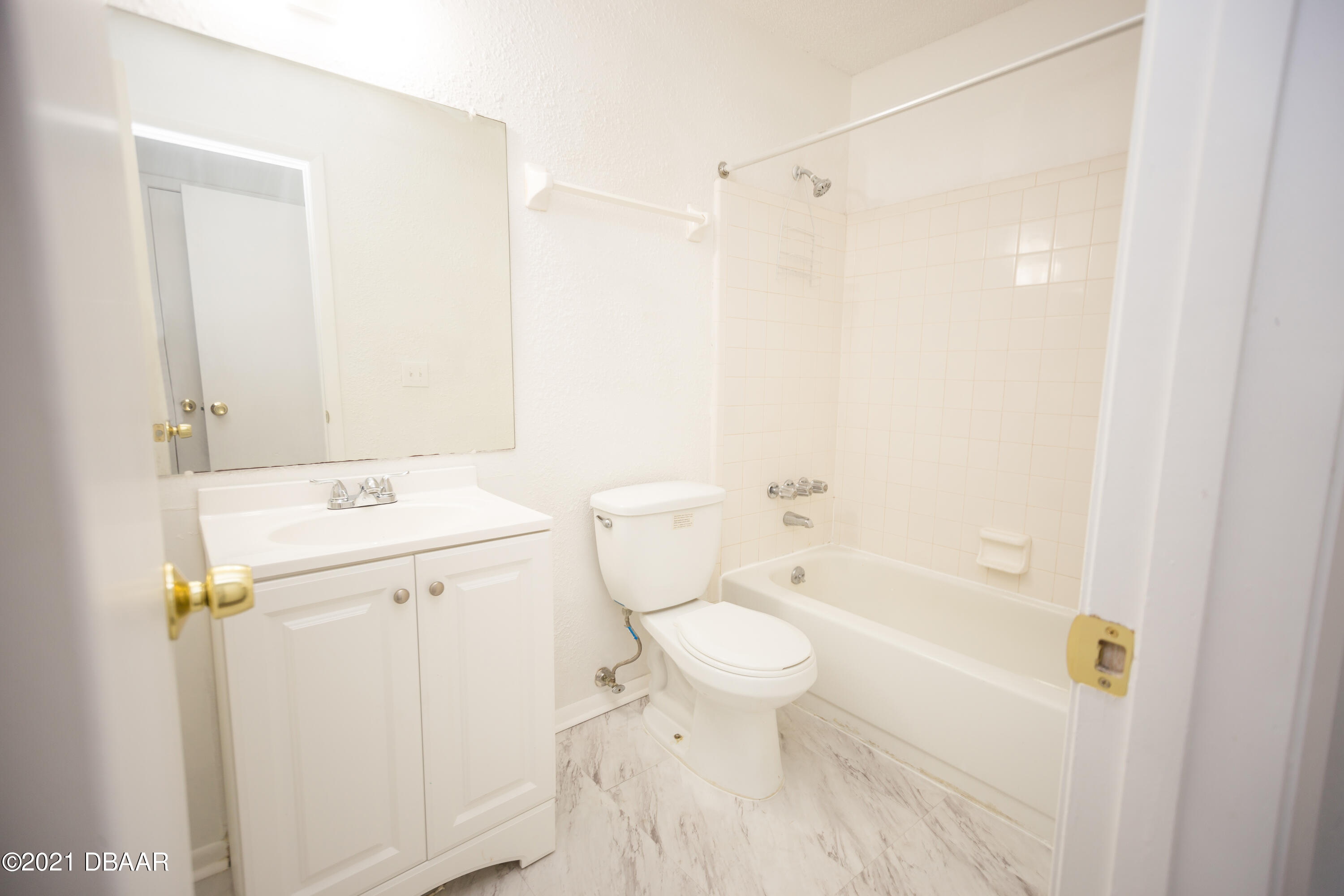 1600 Big Tree Road, Unit B8 South Daytona, FL 32119 - Photo 21 of 27 a bathroom with a sink toilet and shower