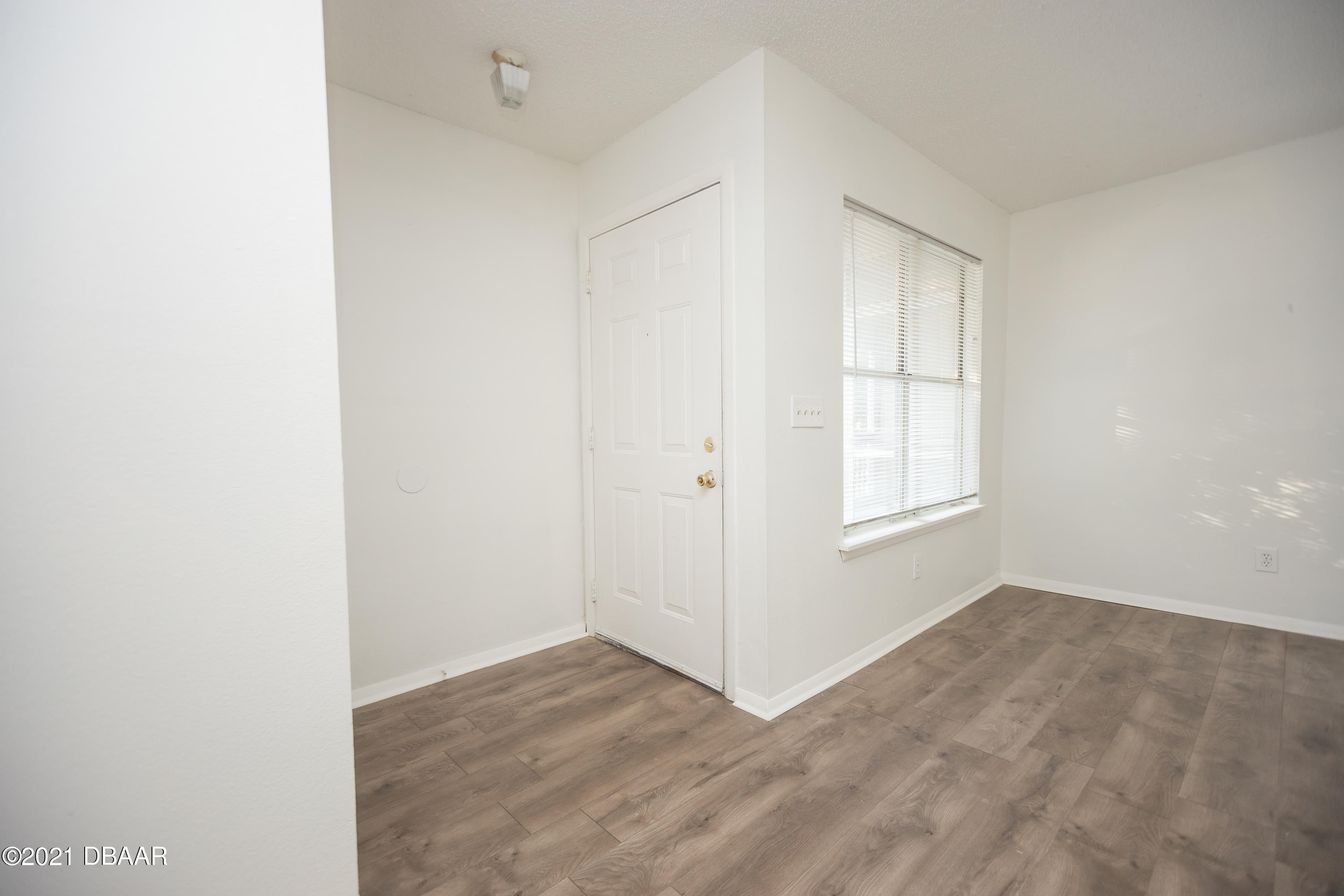 1600 Big Tree Road, Unit B8 South Daytona, FL 32119 - Photo 8 of 27 an empty room with windows and closet