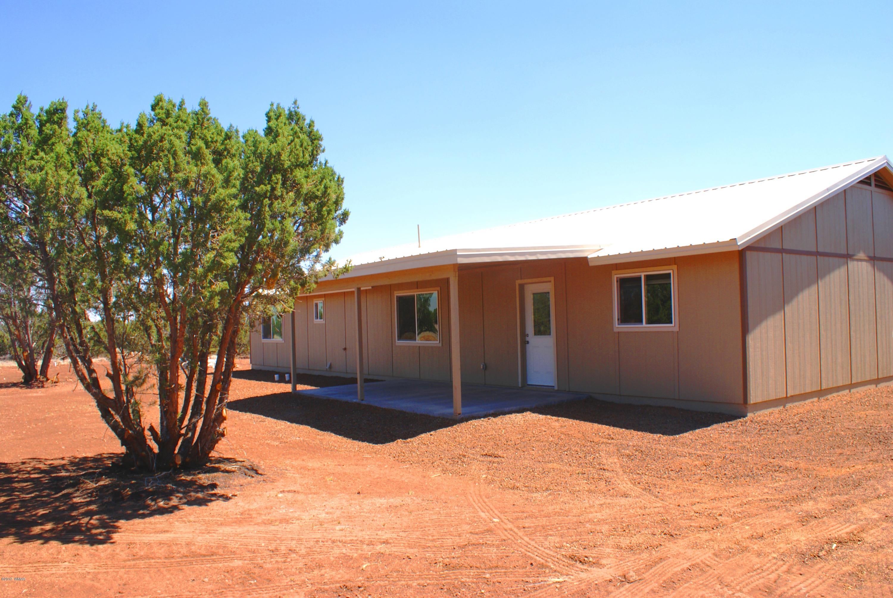 2628 Elk Run Loop Show Low, AZ 85901 - Photo 20 of 26 a front view of a house with a yard