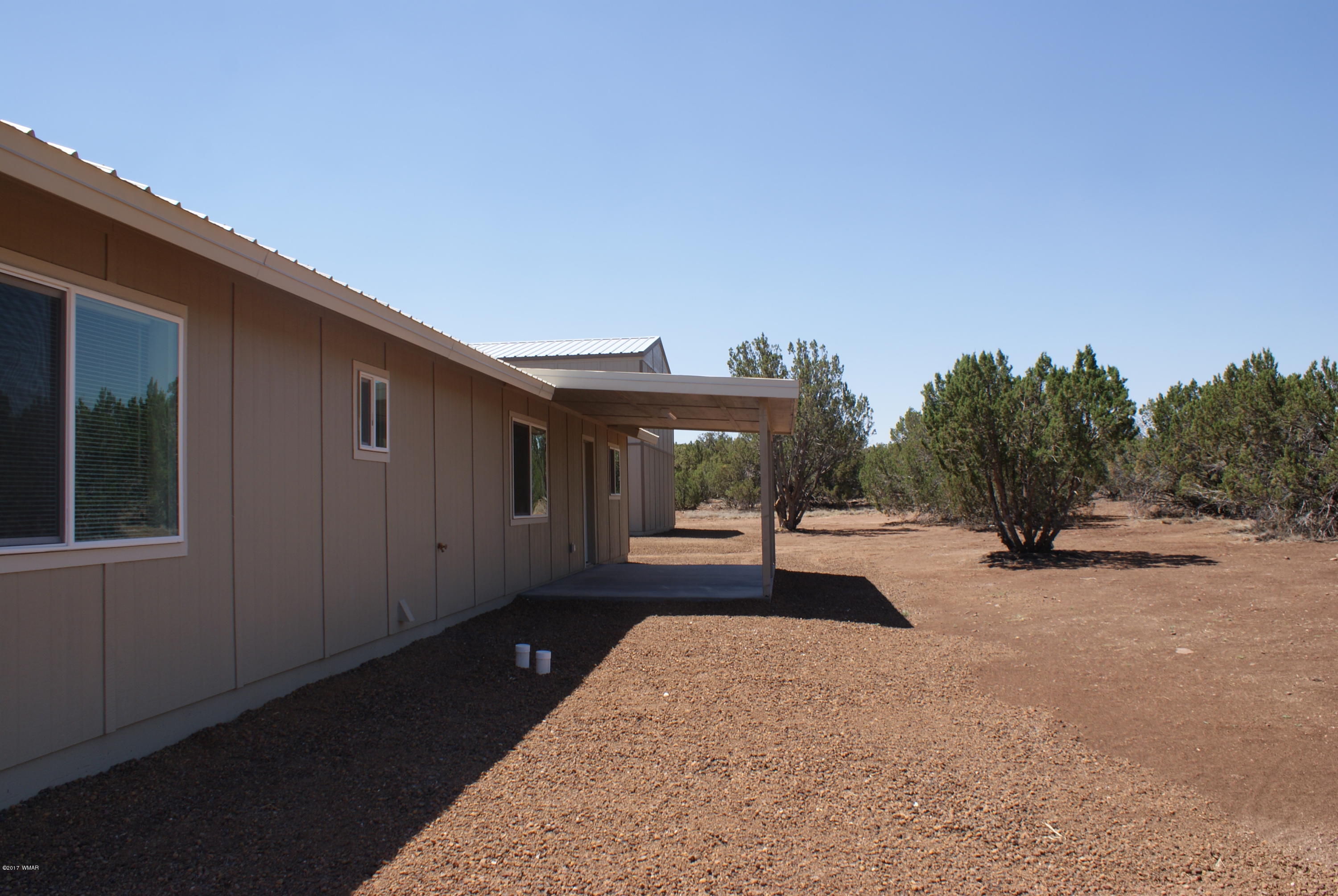 2628 Elk Run Loop Show Low, AZ 85901 - Photo 26 of 26 a view of a house with backyard and sitting area