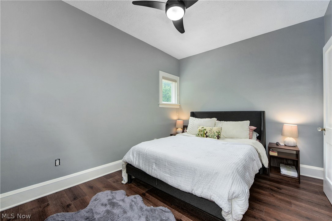 7408-7410 Rutledge Avenue Cleveland, OH 44102 - Photo 19 of 46 Bedroom featuring ceiling fan, dark hardwood / wood-style flooring, and lofted ceiling