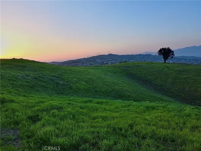 a view of an house with a yard