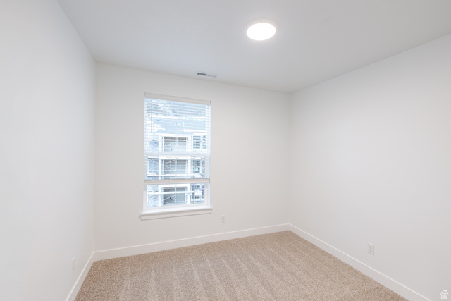 4661 Poplar Way, Unit R302 Mapleton, UT 84664 - Photo 5 of 17 Empty room featuring light colored carpet and baseboards