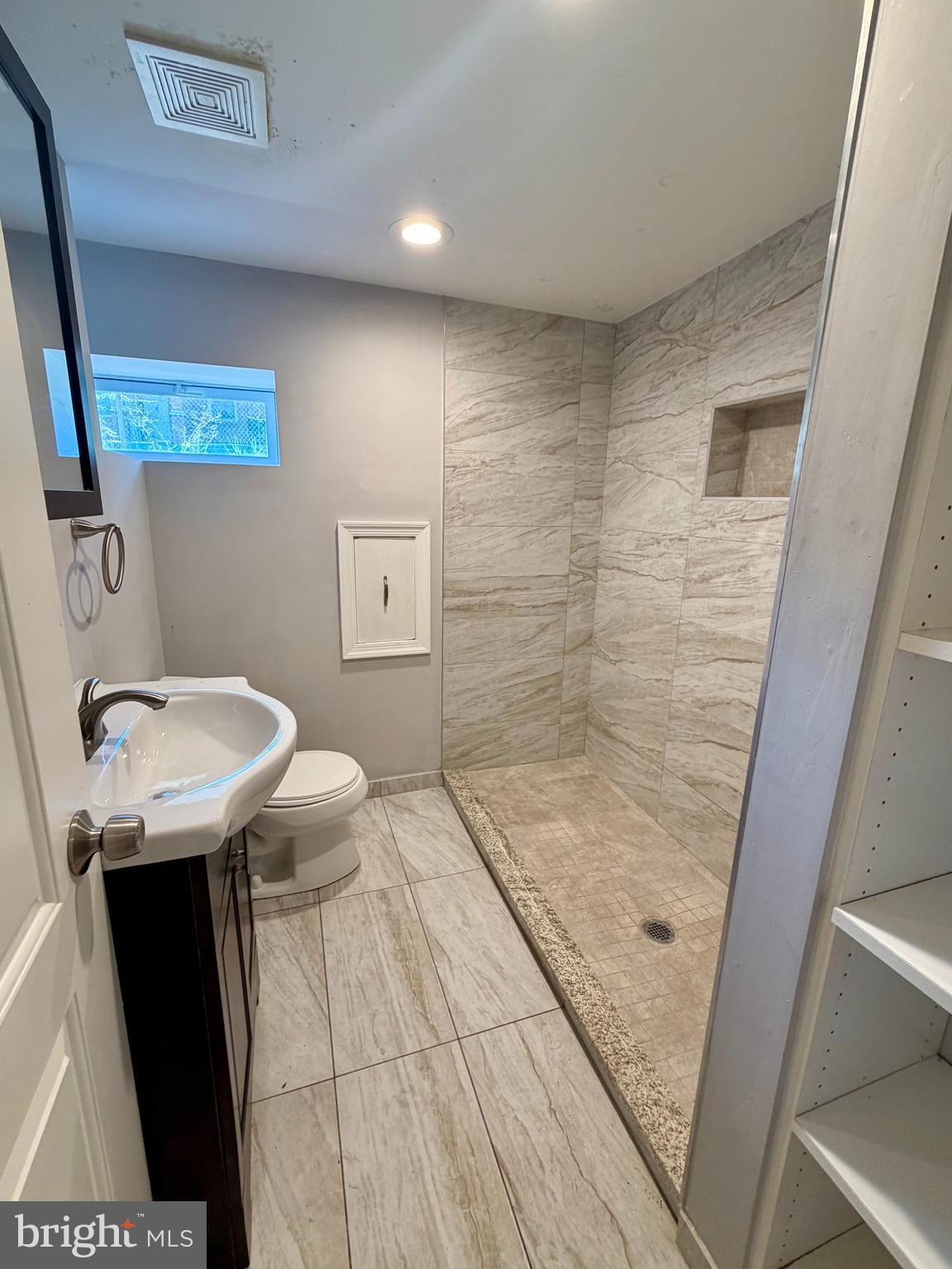 523 Rappolla Street Baltimore, MD 21224 - Photo 11 of 13 a bathroom with a sink and a mirror