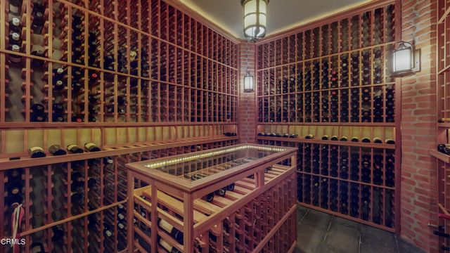 a living room with furniture a rug and a chandelier