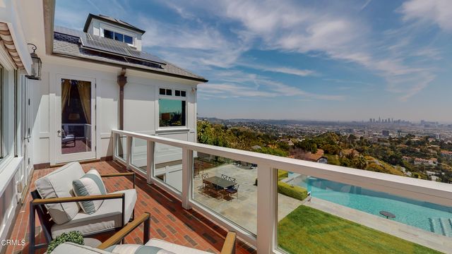 a view of a chairs and table in the patio