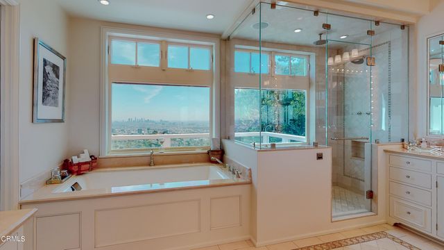 a view of a house with swimming pool and sitting area