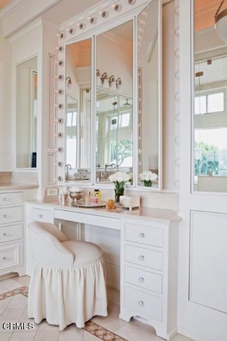 a view of a house with a swimming pool and sitting area