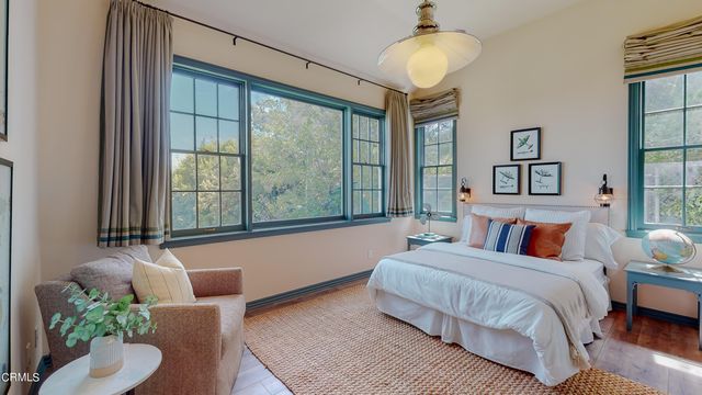 a view of a house with swimming pool and sitting area