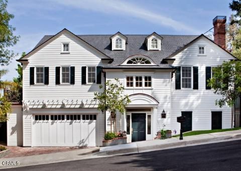 a living room with furniture and flowers