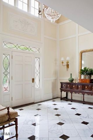 a dining hall with stainless steel appliances granite countertop a stove and refrigerator