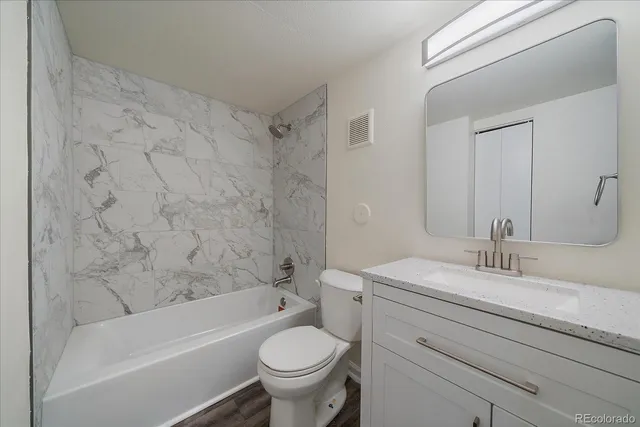 a bathroom with a sink toilet and bathtub