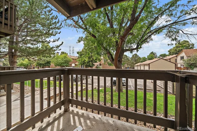 a view of pool with a yard