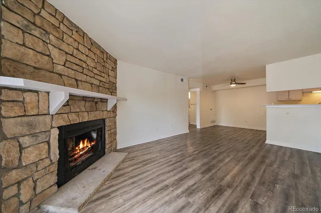 a room with fireplace and wooden floor