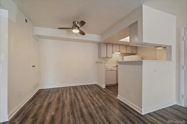 a view of a kitchen with wooden floor