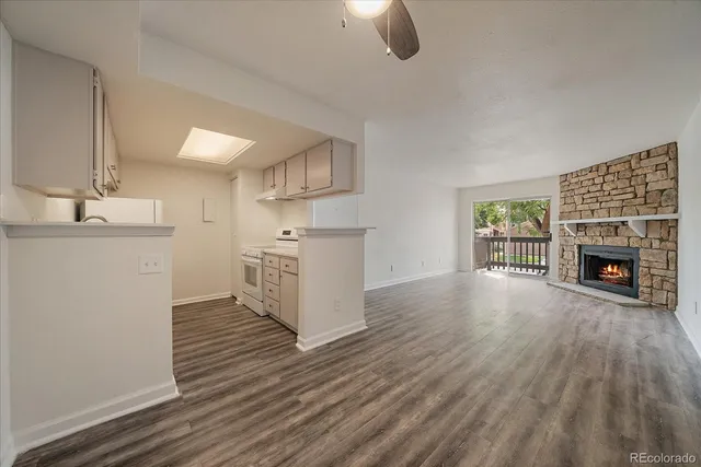 a view of a kitchen with furniture and a fireplace