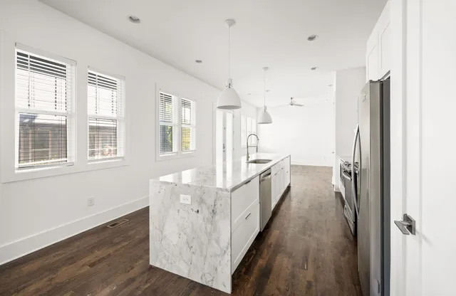 a view of a house with wooden floor and windows